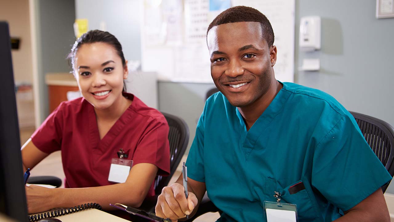 staff working in the clinic doing data entry