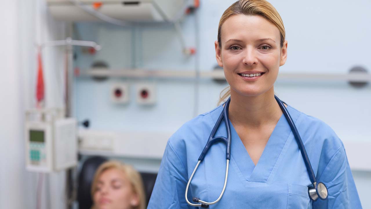 photo of two doctors in the clinic both in blue scrubs