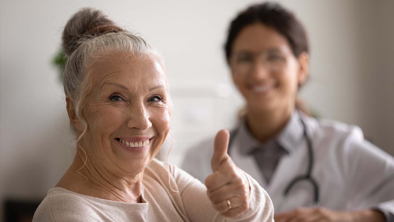 happy woman gives a thumbs up for the weight loss plan